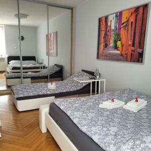 Posteľ alebo postele v izbe v ubytovaní Apartament Przy Rynku
