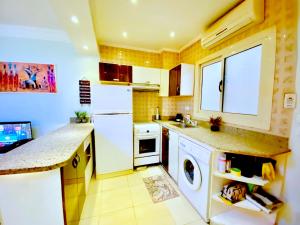 A kitchen or kitchenette at Panda Grey with balcony Hurghada center