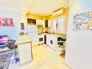 A kitchen or kitchenette at Panda Grey with balcony Hurghada center