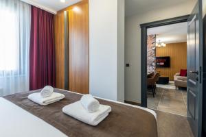 Postel nebo postele na pokoji v ubytování Baymari Suites Design Florya