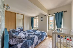 Posteľ alebo postele v izbe v ubytovaní Appartement Cosy en Centre ville