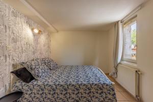 Posteľ alebo postele v izbe v ubytovaní Appartement Cosy en Centre ville