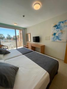 Posteľ alebo postele v izbe v ubytovaní Hotel Neptuno by ON Hotels Group