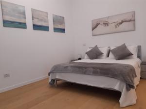 Postel nebo postele na pokoji v ubytování Piazza Mazzini Apartment