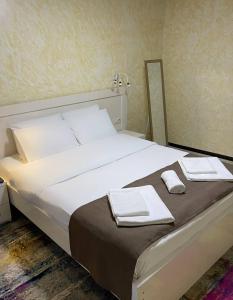 Łóżko lub łóżka w pokoju w obiekcie Hotel Sonata