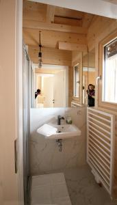 a bathroom with a sink and a mirror at aeki BLOCK in Imst