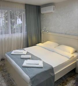 Ein Bett oder Betten in einem Zimmer der Unterkunft Hotel Sonata