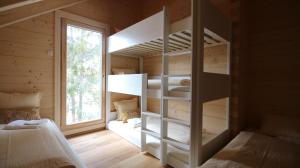 a bedroom with two bunk beds and a window at aeki BLOCK in Imst