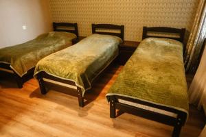 Katil atau katil-katil dalam bilik di Arsenas Guest House