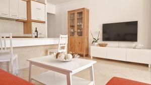 Μια τηλεόραση ή/και κέντρο ψυχαγωγίας στο Costa Sur Apartamento en San Agustín