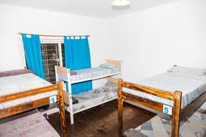 Postel nebo postele na pokoji v ubytování VI&VI HOSTEL MENDOZA