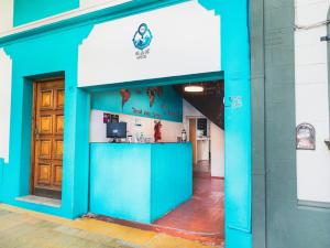 a blue building with a counter in front of it at VI&VI HOSTEL MENDOZA in Mendoza