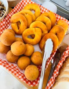 a pile of donuts on a red and white checkered table at El Zócalo Hotel Boutique in Filandia +18 photos