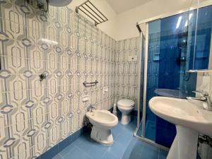 Koupelna v ubytování Apartment in Porto Santa Margherita by Beach