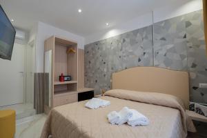 Posteľ alebo postele v izbe v ubytovaní Medina H. Napoli Centro, by ClaPa Group + 37 fotografií