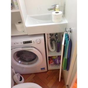 a bathroom with a washing machine and a sink at Welcome Senj TWIN BED ! in Senj