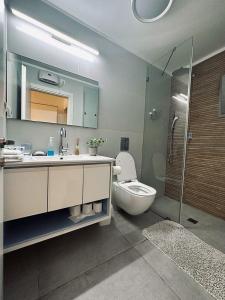 a bathroom with a sink and a toilet and a shower at Luxury 3 Rooms Apartament - NearTheSea Bat Yam in Bat Yam