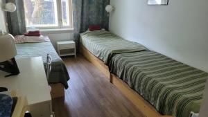 Postel nebo postele na pokoji v ubytování Nepi Hotell