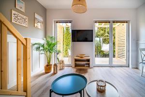 a living room with a table and chairs at Rewa House in Rewa