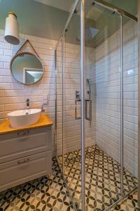 a bathroom with a sink and a shower at Rewa House in Rewa