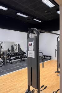 a fitness room with a gym with machines at Rentalux Hostel in Timrå