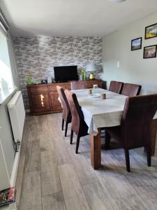 a dining room with a table and chairs at Ferienhaus am Sauerbrunnen in Daun +33 photos