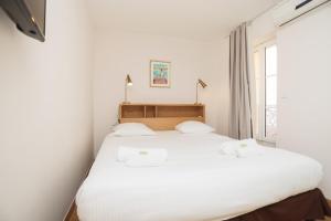 Posteľ alebo postele v izbe v ubytovaní IMMOGROOM - Beautiful and Cosy - Air conditioner - 5 min from beaches
