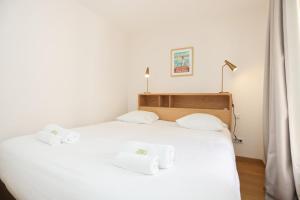 Posteľ alebo postele v izbe v ubytovaní IMMOGROOM - Beautiful and Cosy - Air conditioner - 5 min from beaches
