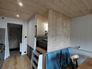 Ein Bett oder Betten in einem Zimmer der Unterkunft L'échappée étoilée - Métabief