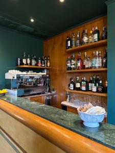 a bar with a bowl of food on a counter at Hotel Atlantico in Castiglioncello