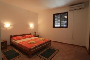Posteľ alebo postele v izbe v ubytovaní Apartments Pinus