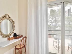a mirror sitting on a shelf next to a window at 永安101 Wing on x 附陽台 in Taitung City