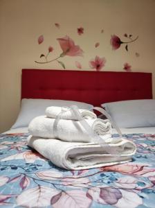 Un ou plusieurs lits dans un hébergement de l'établissement Miro B&B