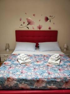 Un ou plusieurs lits dans un hébergement de l'établissement Miro B&B