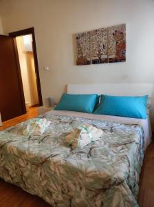 Un ou plusieurs lits dans un hébergement de l'établissement Miro B&B