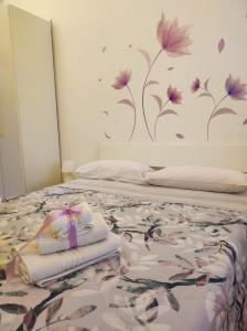 Un ou plusieurs lits dans un hébergement de l'établissement Miro B&B