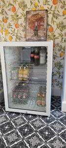 an open refrigerator with food and drinks in it at Boutique B&B Dolce Due in Assendelft