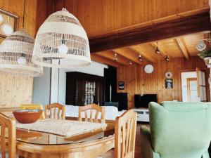 a dining room with a table and chairs at Apartaments Cel i Fusta in Camprodon