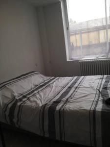 Posteľ alebo postele v izbe v ubytovaní Le Studio Élégance du centre