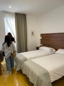 Postel nebo postele na pokoji v ubytování ROMANDRE