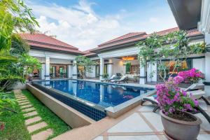 an image of a house with a swimming pool at Siam Jewel - Private pool villa in Bang Tao in Bang Tao Beach