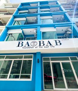 a blue building with aba foundation of the east lvl at BAOBAB in Patong Beach