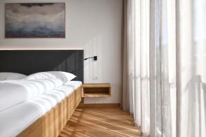 A bed or beds in a room at Apartments Johanna