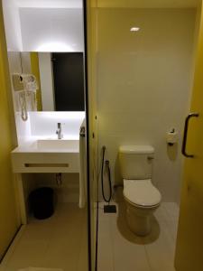 a bathroom with a toilet and a sink at Comfy Room In Genting Highlands in Genting Highlands