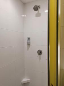 a bathroom with a shower with a shower head at Comfy Room In Genting Highlands in Genting Highlands