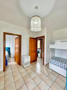 Ένα ή περισσότερα κρεβάτια σε δωμάτιο στο Casa vacanze Stintino vista mare