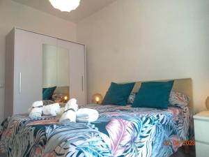 Cama ou camas em um quarto em Villa Andorinha
