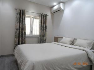 Cama ou camas em um quarto em Villa Andorinha