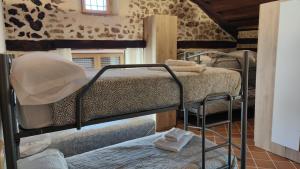a bedroom with two bunk beds in a room at La canongia in Segovia