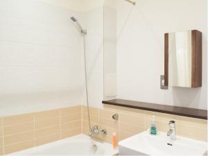 a bathroom with a sink and a shower at Modern 2BD2Bath Apart CityCentre in Glasgow